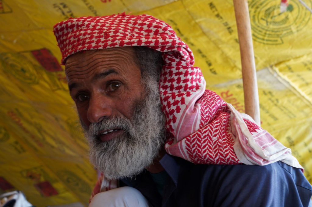 Bedouin host answers questions in his home near Dana Biosphere Reserve, Wadi Arabah, Jordan, image by Marie Goff